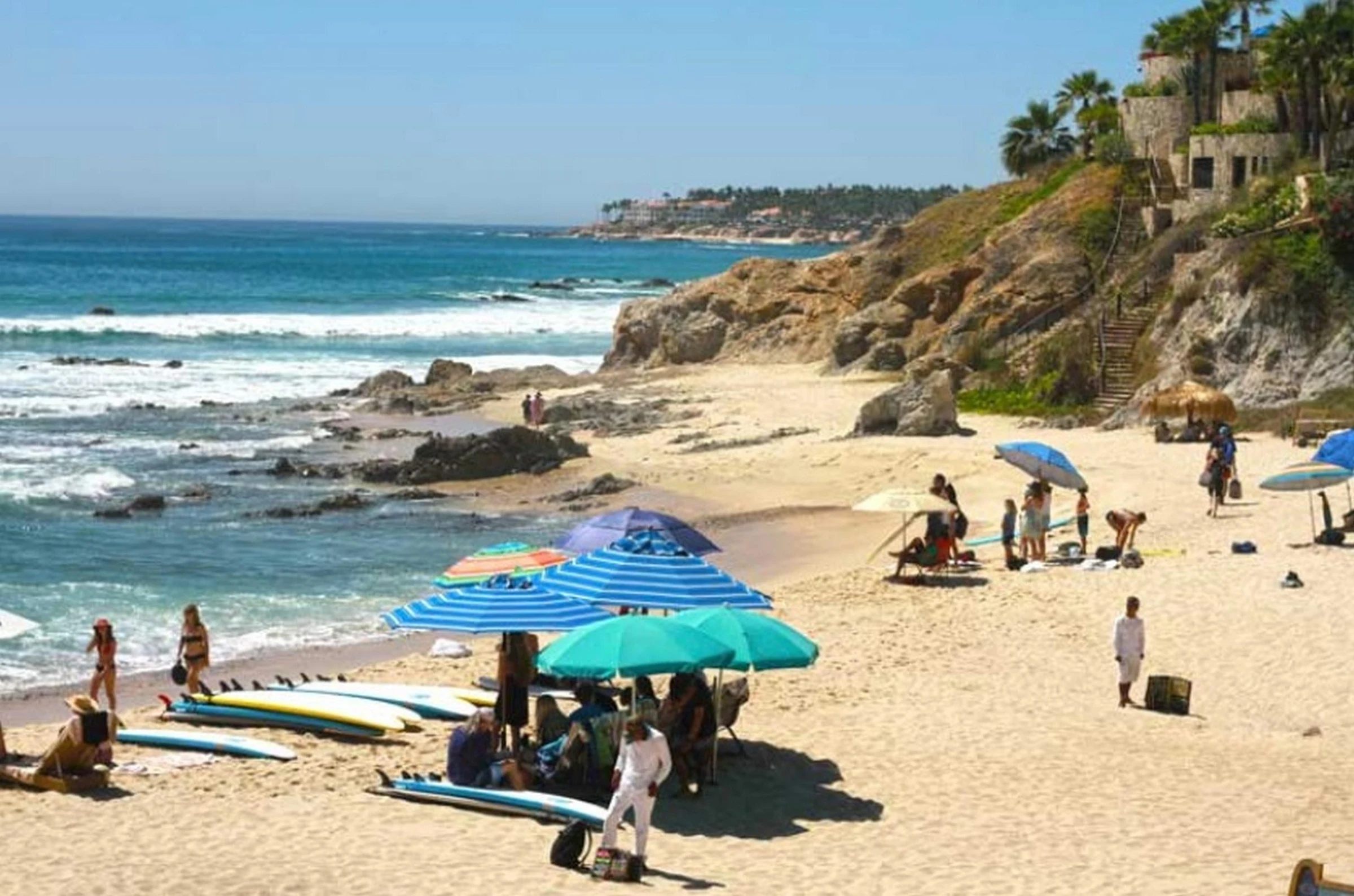 Surfboards and umbrellas on the beach at Costa Azul