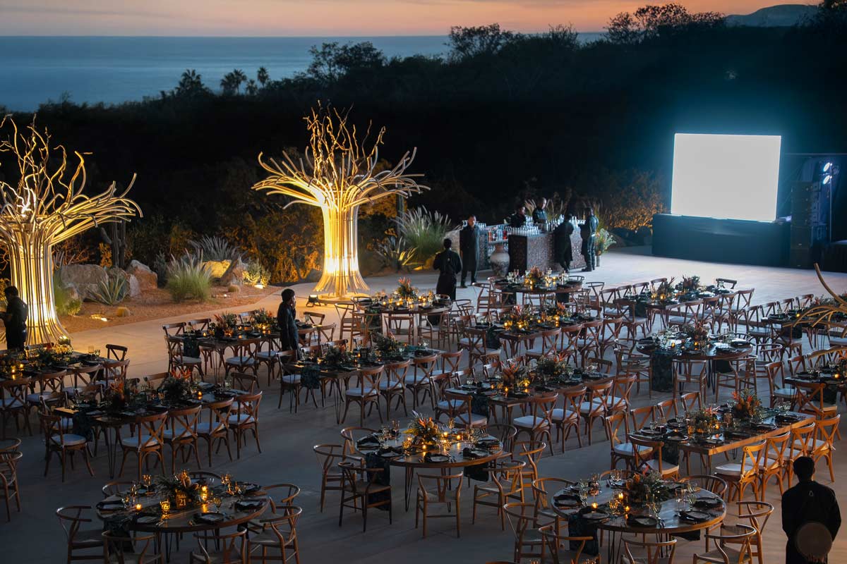 Amara terrace at dusk with set tables and the Sea of Cortez horizon in Cabo San Lucas
